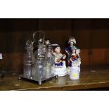 Various Staffordshire figures and a cruet