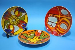 Three Poole pottery wall plates.