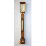 An oak cased stick barometer.