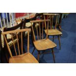 Three Ercol spindle back chairs.