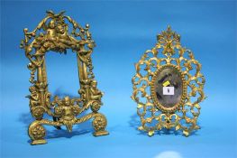 Two ornate gilt easel frames.