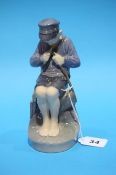 Royal Copenhagen figure of a boy fishing with a po