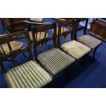Four reproduction mahogany dining chairs.