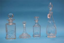 Four glass decanters.