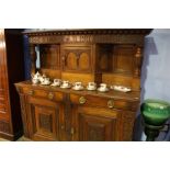 A large heavily carved oak court cupboard, 182cm w