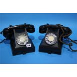 Two Bakelite telephones.