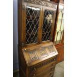 Carved oak linen fold bureau bookcase, 78 x 174cm.