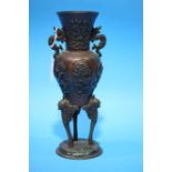 An Oriental bronze vase. 24cm height.