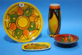 Four pieces of Poole pottery.