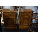 A pair of pine bedside cabinets, 49cm wide.