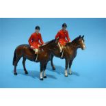 Two Beswick Huntsmen with red tunics, seated upon