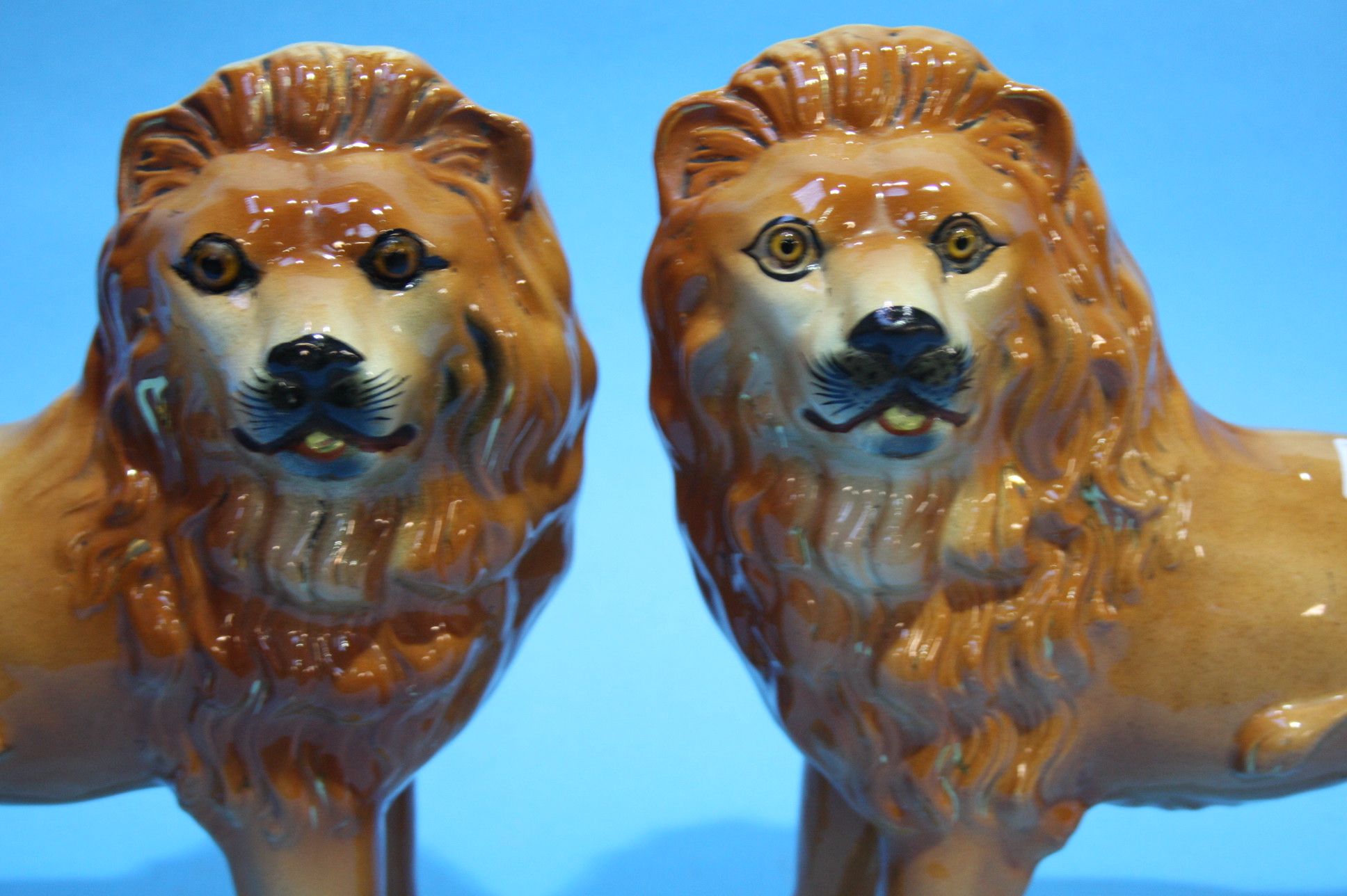 A pair of Staffordshire standing lions. - Image 2 of 2