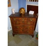 A Georgian walnut chest of drawers with three shor