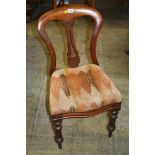 Three mahogany dining chairs.