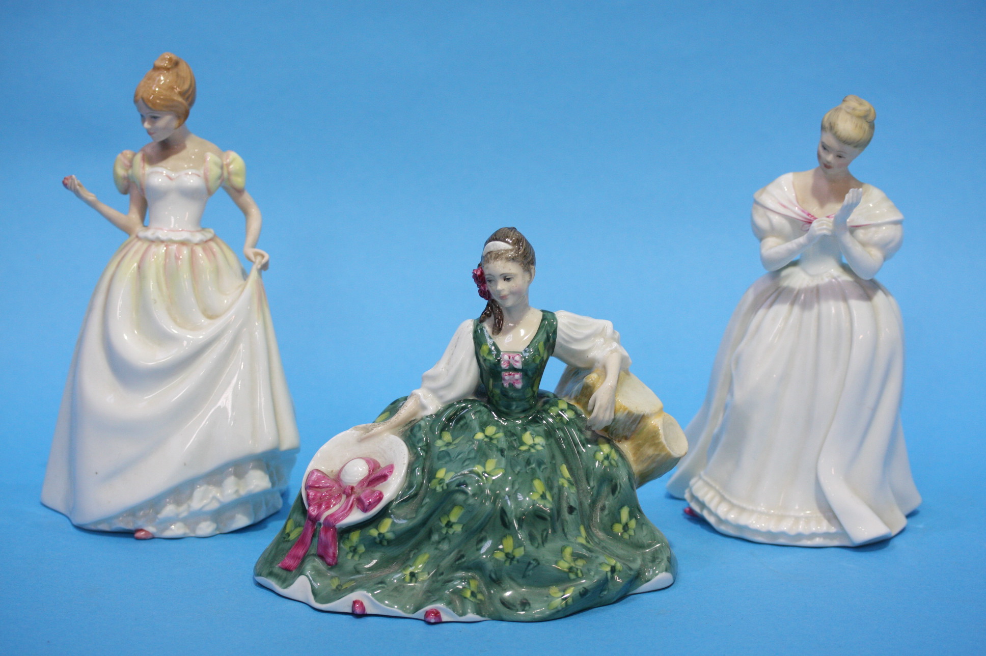 Three Royal Doulton ladies.