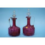 A pair of Victorian Cranberry glass decanters.