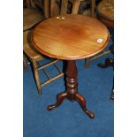 A Victorian mahogany circular tripod table.