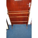 An Edwardian mahogany towel rail.