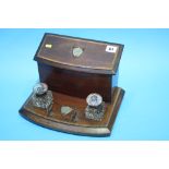 An Edwardian mahogany desk tidy.