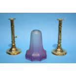 A pair of brass candlesticks and a Cranberry frost