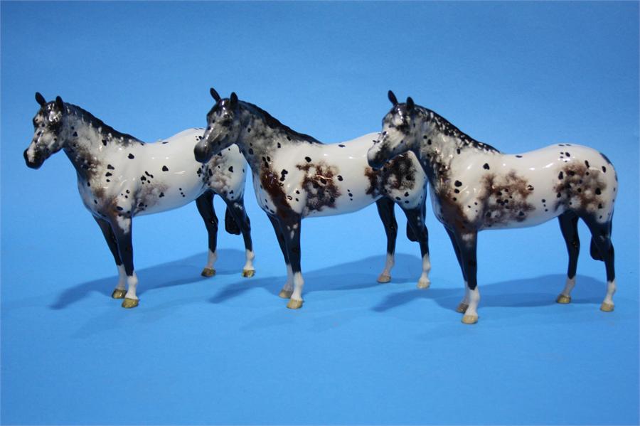 Three Beswick Palomino horses.