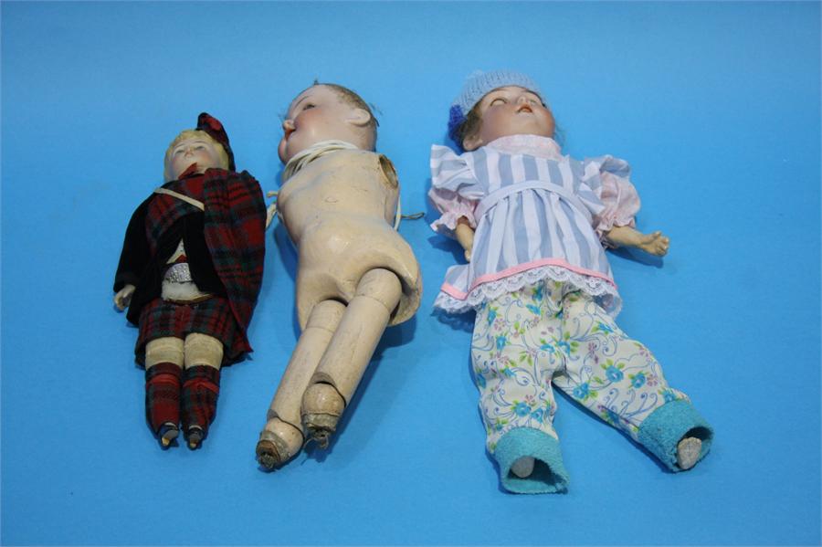 Two Continental Bisque porcelain headed dolls and