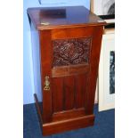 A mahogany bedside cabinet.