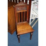 An oak hall chair.