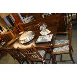 An oak drawer leaf refectory table and six chairs.