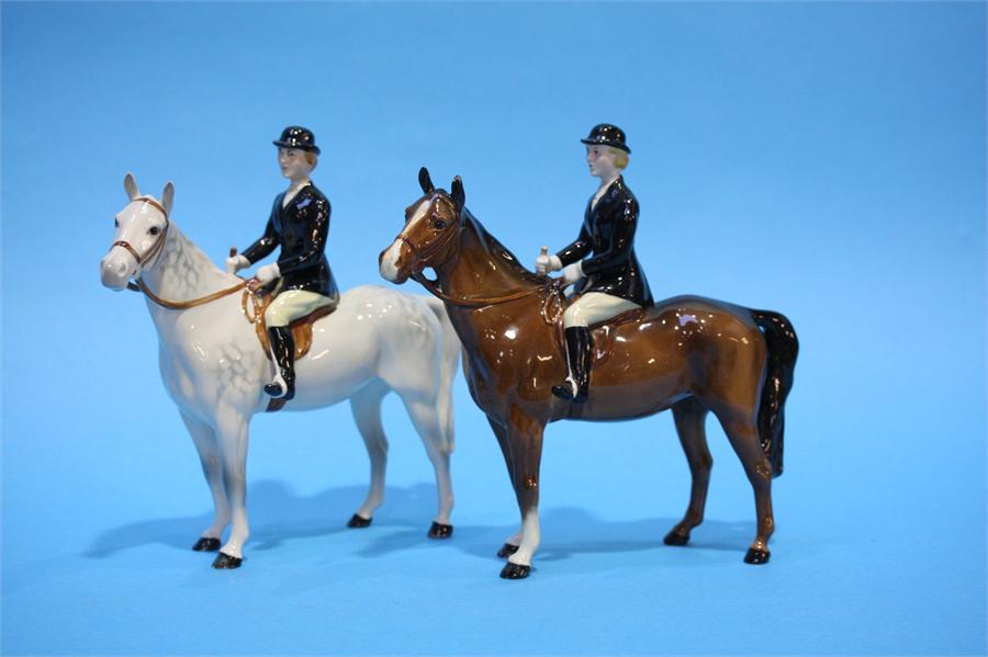 A Beswick Huntswoman on a grey horse and another o