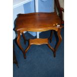 A mahogany occasional table.