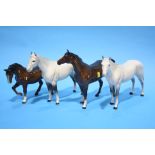 Four Beswick horses.