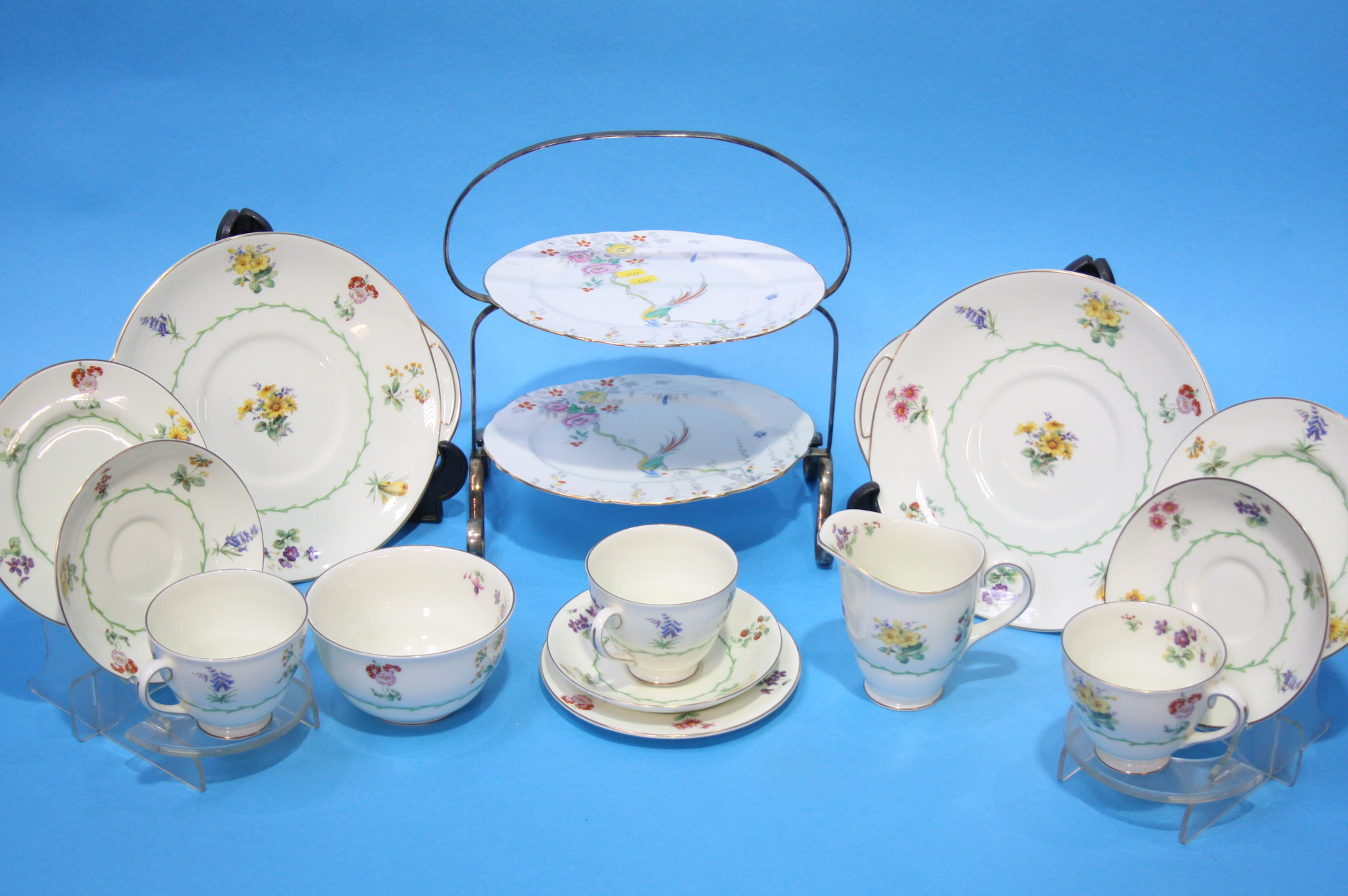 A Royal Doulton floral tea set and a cake stand.