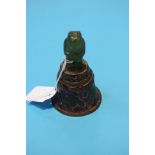 An Oriental enamelled bell with jade handle.