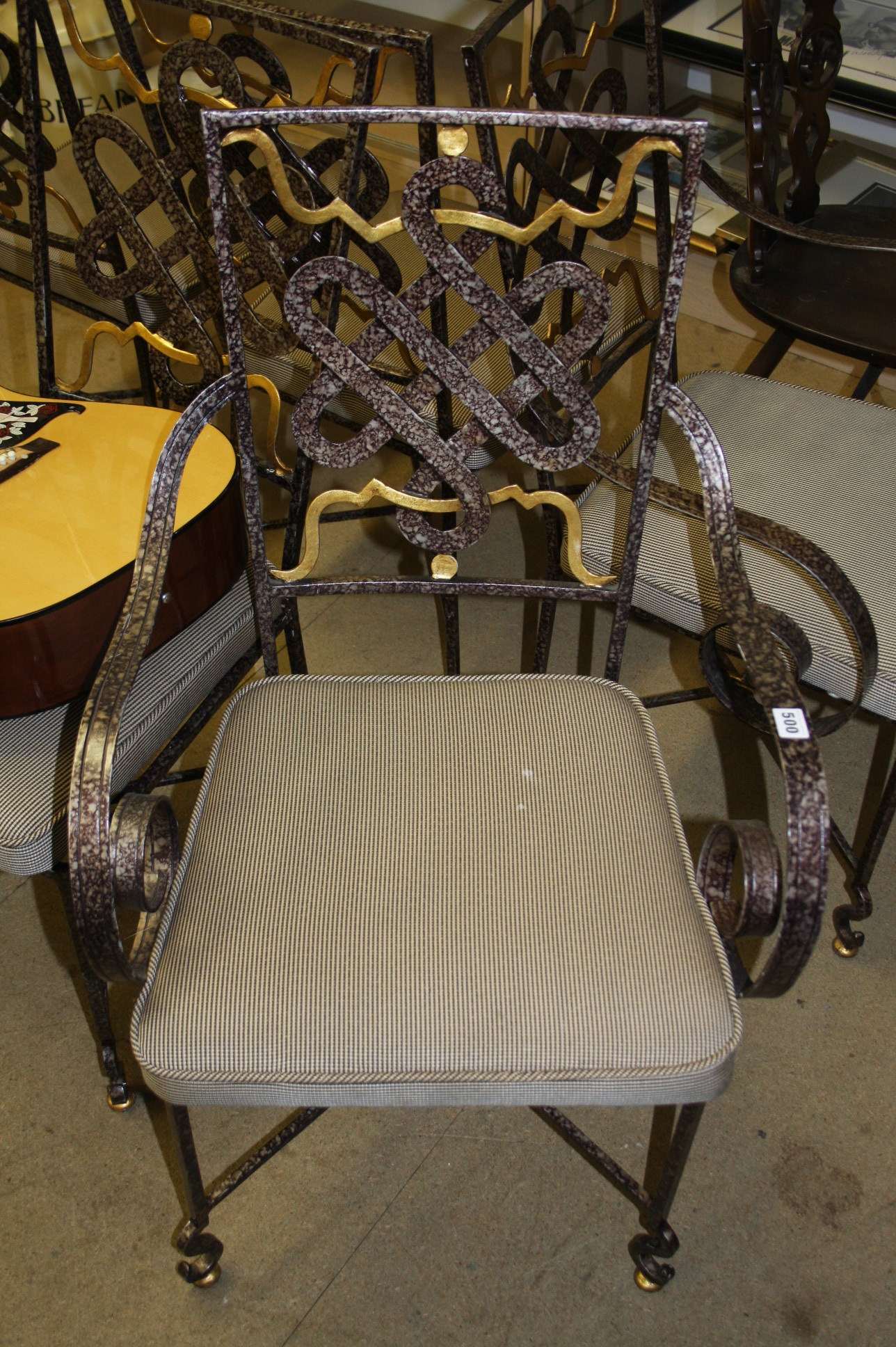 A set of six modern metal chairs.