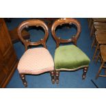 A pair of Victorian mahogany balloon back chairs.