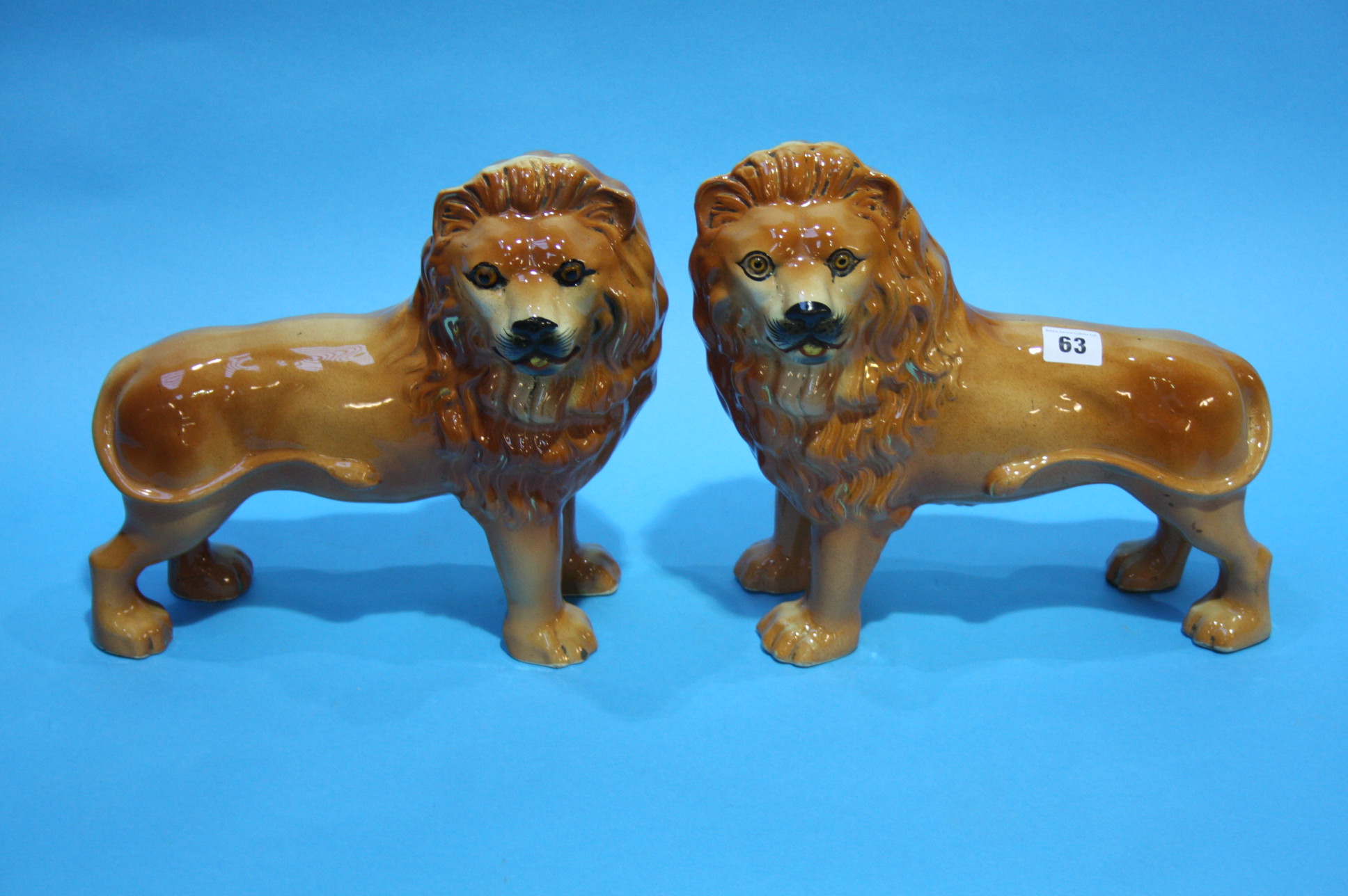 A pair of Staffordshire standing lions.