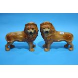 A pair of Staffordshire standing lions.