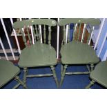 Set of four green painted chairs.