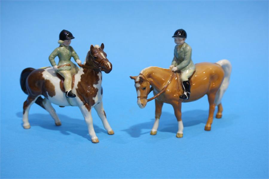 Two Beswick Ponies with boy and girl.