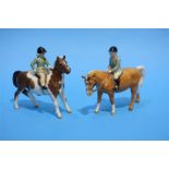 Two Beswick Ponies with boy and girl.