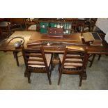 An oak refectory table and six chairs.