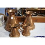 4 Graduated copper jugs