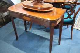 A Victorian mahogany fold over tea table