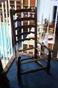 A 19th century Elm ladderback rocking chair