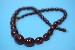 String of amber coloured beads