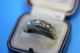An 18ct gold pearl and diamond ring