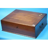 A mahogany box containing table linen