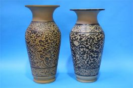 Two large earthenware vases with wide flared rims,