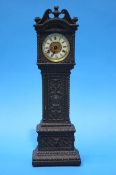 A small metalware long case clock by Ansonin Clock